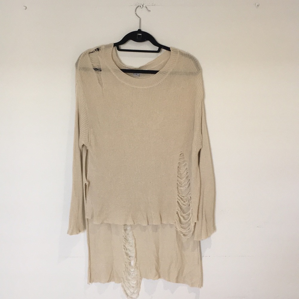 A very long sweater, practically a cover up